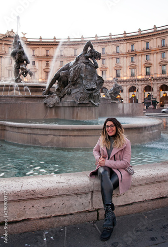 A girl posing for a photo near the Fontana delle Naiadi in Rome, Italy  photo