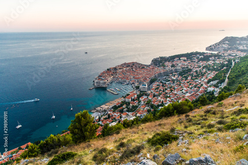 Fototapeta Naklejka Na Ścianę i Meble -  Dubrovnik, Croatia - July, 2019: View from the top of the mountain of Srdj to the old part of the city in the fortress in Dubrovnik, Croatia.
