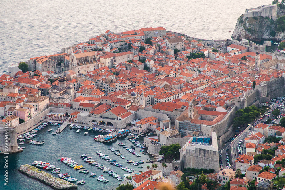 Dubrovnik, Croatia - July, 2019: View from the top of the mountain of Srdj to the old part of the city in the fortress in Dubrovnik, Croatia. Dubrovnik, Croatia - July, 2019: View from the top of the mountain of Srdj to the old part of the city in the fortress in Dubrovnik, Croatia.