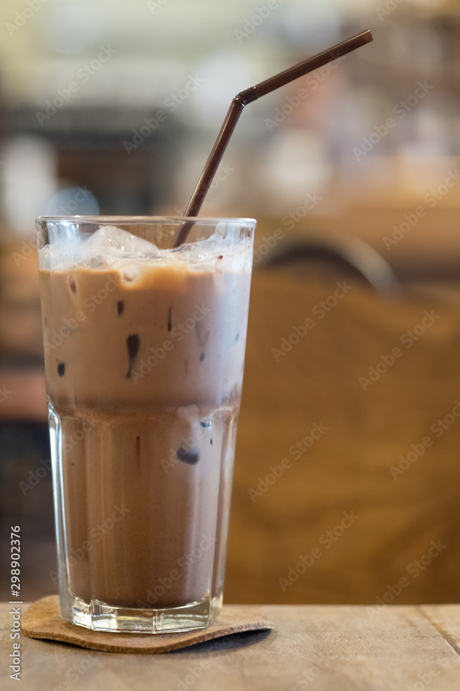 Iced Mocha coffee in glass on the wooden table Iced Mocha coffee in glass on the wooden table