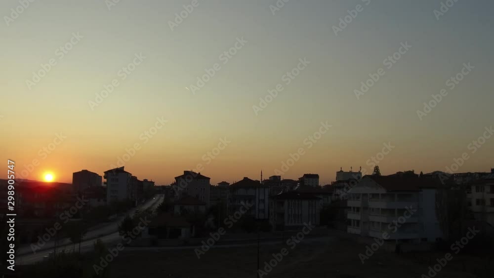 sunset city views, a town at sunset,