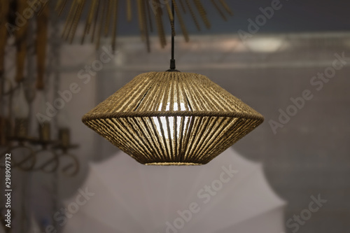 Woven rope chandelier, natural wicker fabric lampshade on the pendant lamp