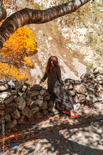 An Ossetian woman prays in a sacred place on a mountain in Fiagdon. photo