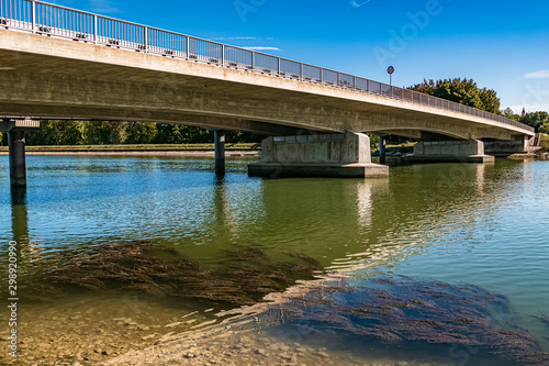 Beautiful bridge with reflections at Dingolfing water reservoir, Isar, Bavaria, Germany