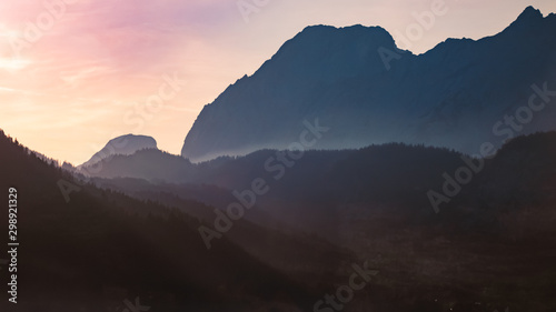 Beautiful alpine sunrise view with mountain silhouettes near Ehrwald, Tyrol, Austria