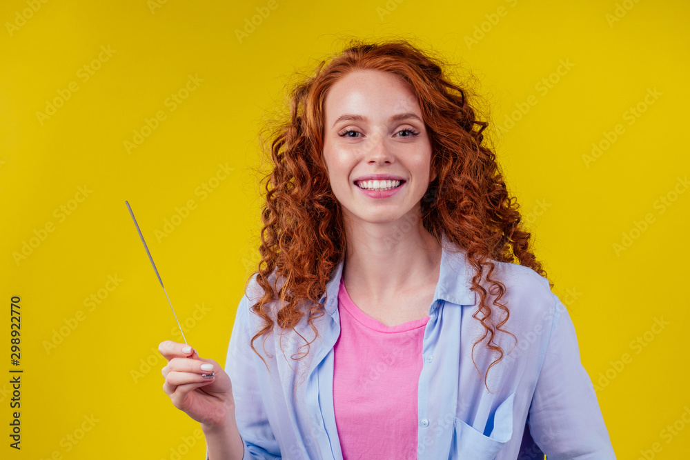 Close-up photo of cheerful caucasian girl holding bengal light with sparklers Close-up photo of cheerful caucasian girl holding bengal light with sparklers