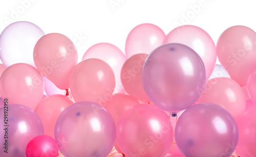 Pink and purple balloons isolated on white.