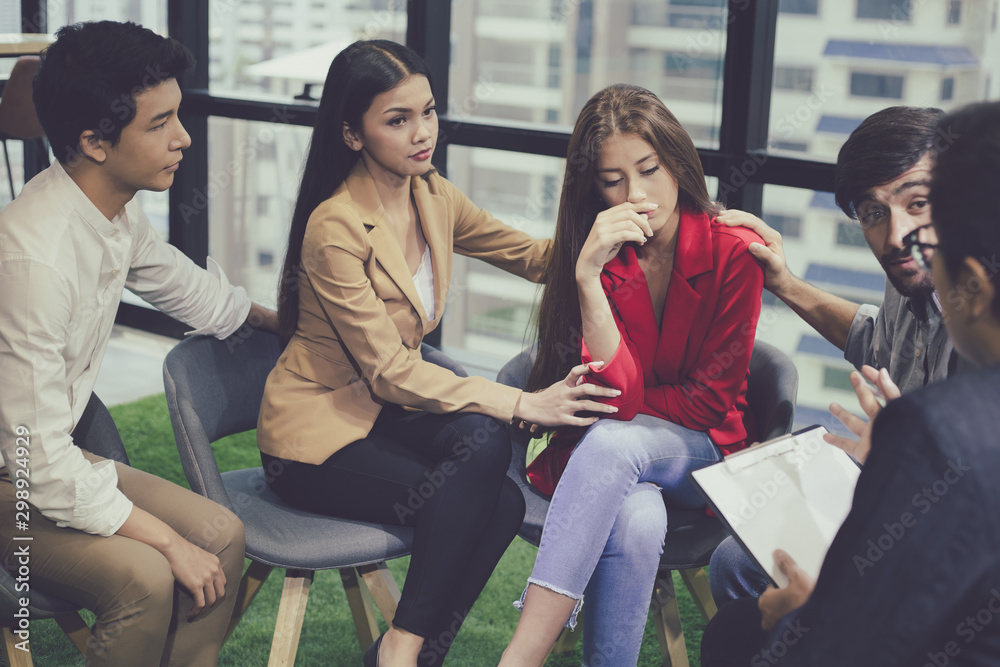 Fototapeta premium Group problematic young people talking with a guidance counselor.