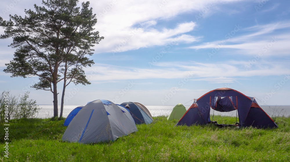 A tent camp by the sea. The concept of a pleasant family holiday.