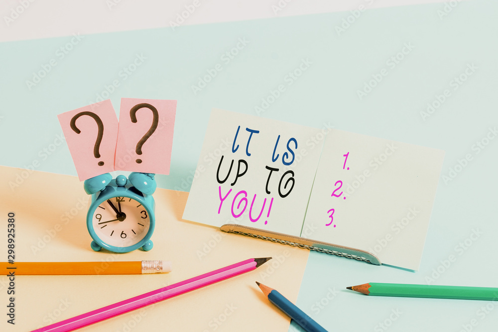 Writing note showing It Is Up To You. Business concept for Used to tell a demonstrating that they are the one to decide Mini size alarm clock beside stationary on pastel backdrop