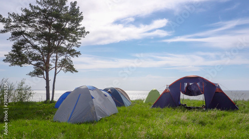 A tent camp by the sea. The concept of a pleasant family holiday.