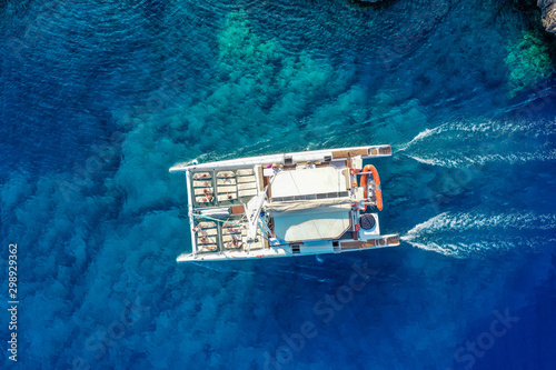 Sailing catamaran on the turquoise sea water, aerial view, mediterranean, Cyprus photo