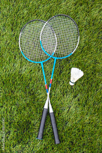 badminton racket and shuttlecock on strings