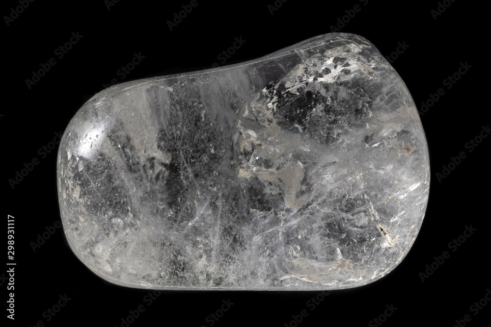 Polished clear quartz mineral from Brazil isolated on a pure black background. Polished clear quartz mineral from Brazil isolated on a pure black background.