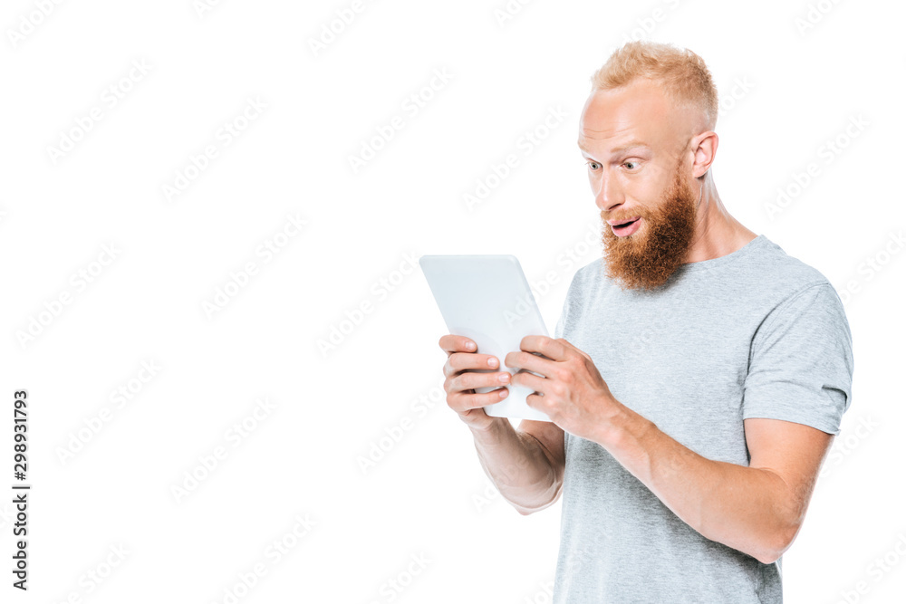 surprised man using digital tablet, isolated on white surprised man using digital tablet, isolated on white