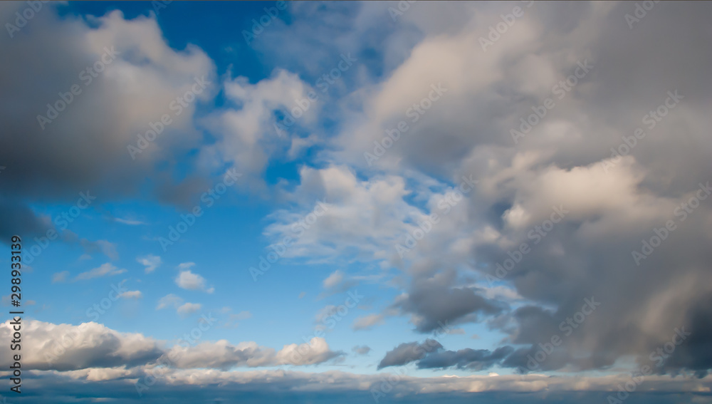 Cumulus clouds over the earth in late autumn