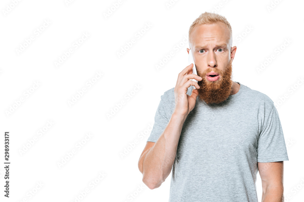 shocked bearded man talking on smartphone, isolated on white shocked bearded man talking on smartphone, isolated on white