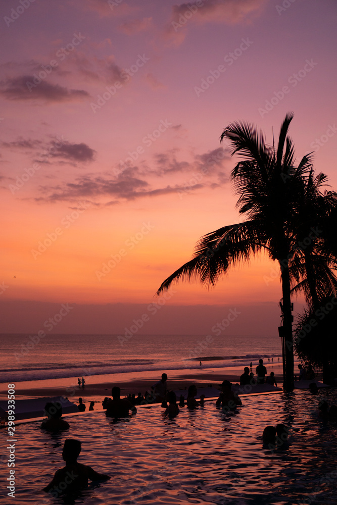 Sunset in Bali over the ocean with reflexion