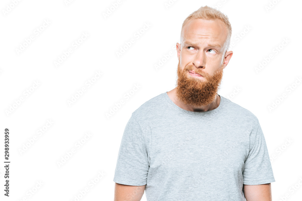 handsome thoughtful bearded man in grey t-shirt, isolated on white handsome thoughtful bearded man in grey t-shirt, isolated on white