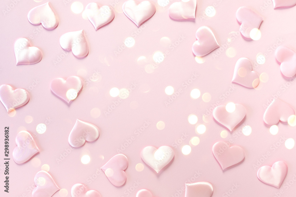 Beautiful silk pink hearts on a pink background. Holiday concept Valentine Day. Plase for text . Flat lay.