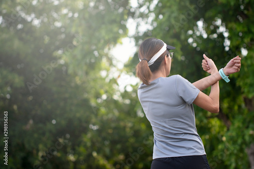 Fototapeta Naklejka Na Ścianę i Meble -  Healthy lifestyle sports, Young female workout before fitness training at the park