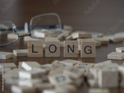 The concept of Long represented by wooden letter tiles