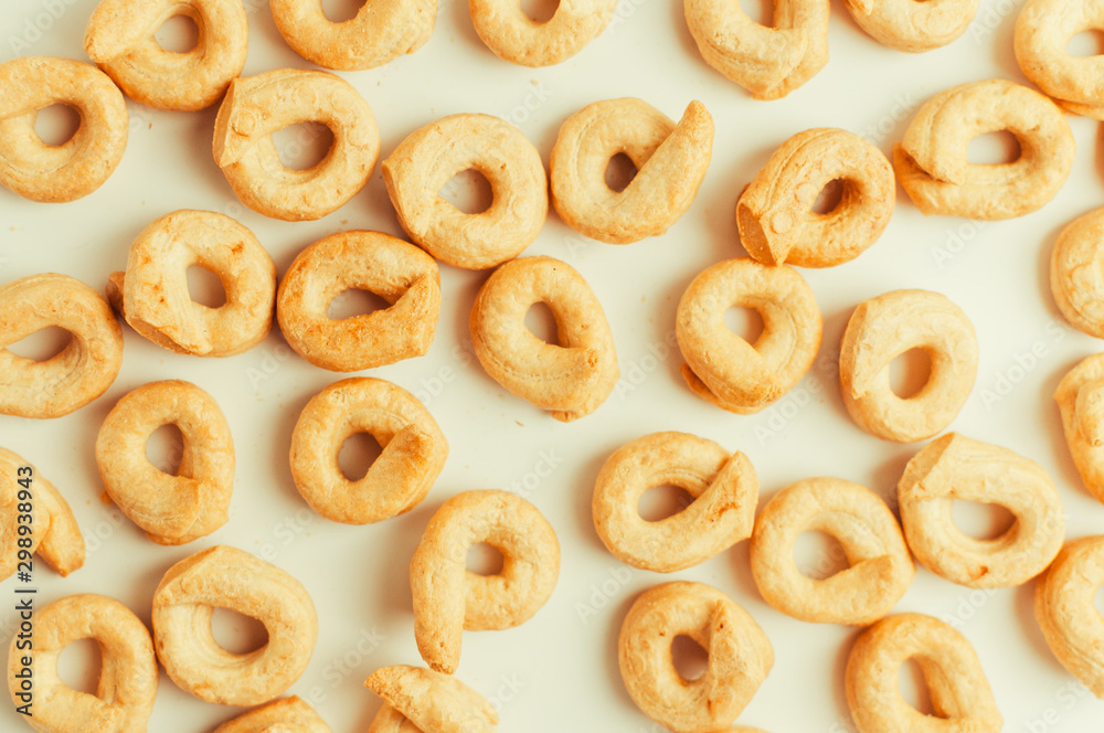Taralli - a traditional Italian snack similar to drying or bagels, typical for the cuisine of Sicily and Calabria. Bagel on a white background, isolate pattern. Copy space.