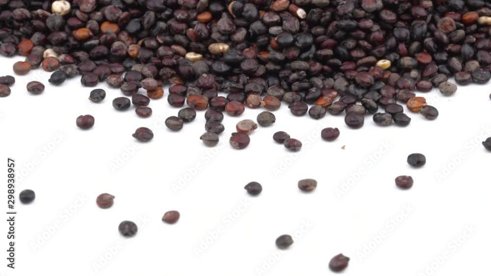 Handful of black quinoa seeds rotating. Gluten free cereals, healthy diet concept. Isolated, on white background. Copy space shot Handful of black quinoa seeds rotating. Gluten free cereals, healthy diet concept. Isolated, on white background. Copy space shot