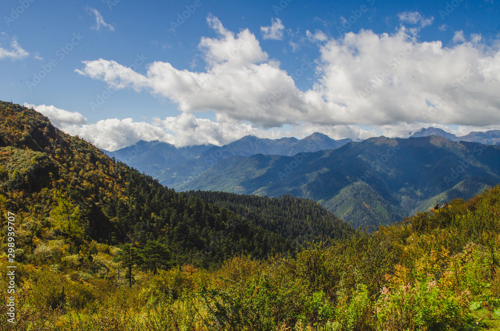 The picturesque view of the Himalayan range from the cliff of Chele la pass in Bhutan The picturesque view of the Himalayan range from the cliff of Chele la pass in Bhutan