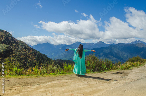 Indian traveller wandering in Chele la pass in Bhutan to enjoy the tranquil of serene mountains