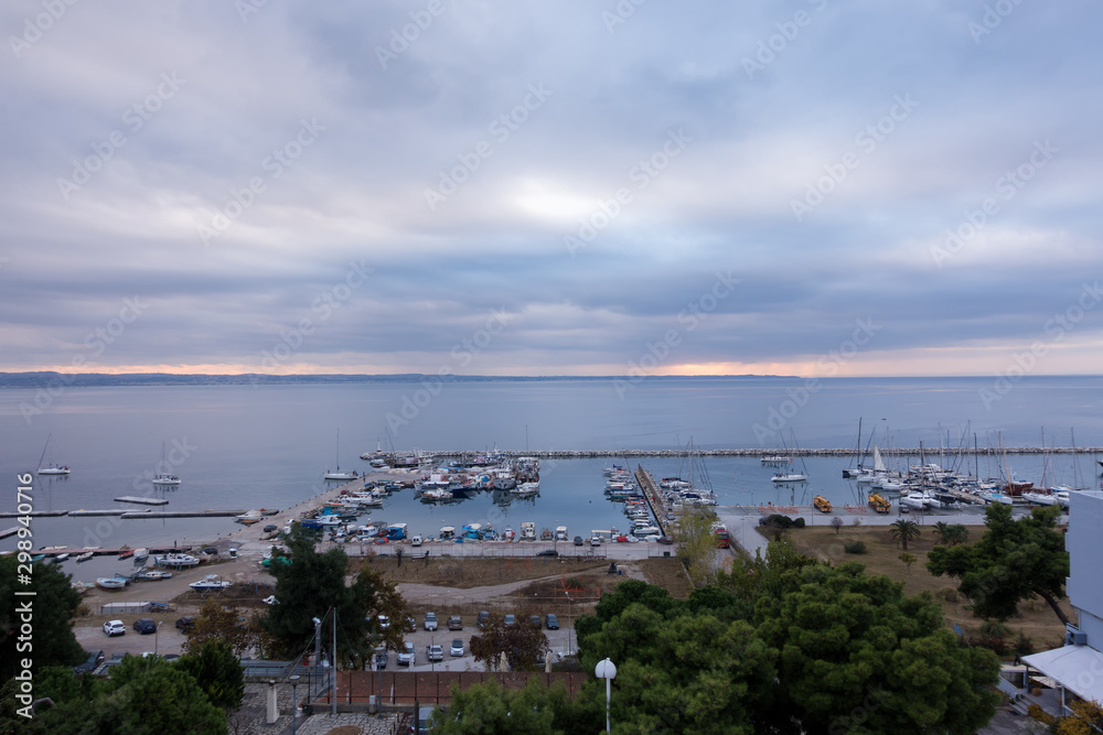 Fototapeta premium Amazing view to the sea and the marina in Kalamaria, Thessaloniki, Greece, under a cloudy sky