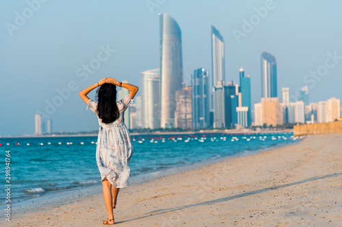 Female tourist on Abu Dhabi city beach