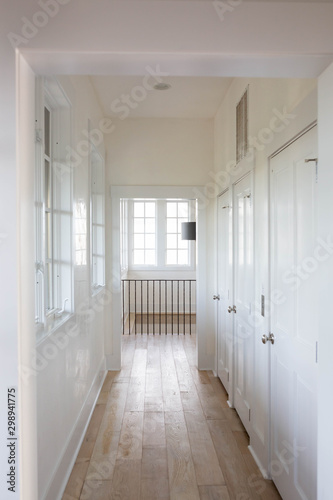 White Hallway with Natural Wood Floors © KCULP