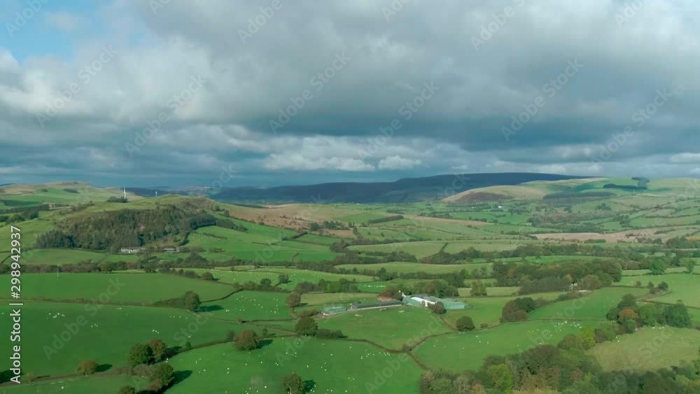 Spectacular aerial view over vast sweeping green fields at Builth Wells, Wales Spectacular aerial view over vast sweeping green fields at Builth Wells, Wales