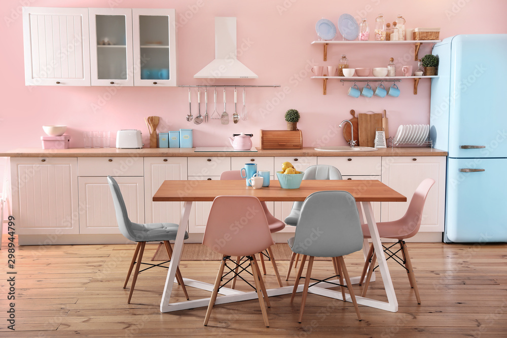 Stylish kitchen interior with dining table and chairs - obrazy, fototapety, plakaty 