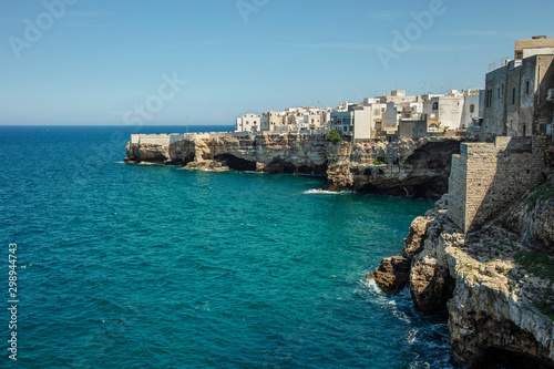 Above the blue southern sea is a white-stone city on a high cliff