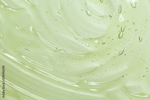Aloe vera gel texture. Clear cosmetic cream, face serum, moisturizer background photo