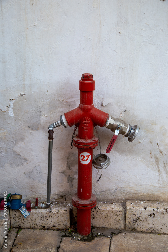red fire hydrant on wall background red fire hydrant on wall background