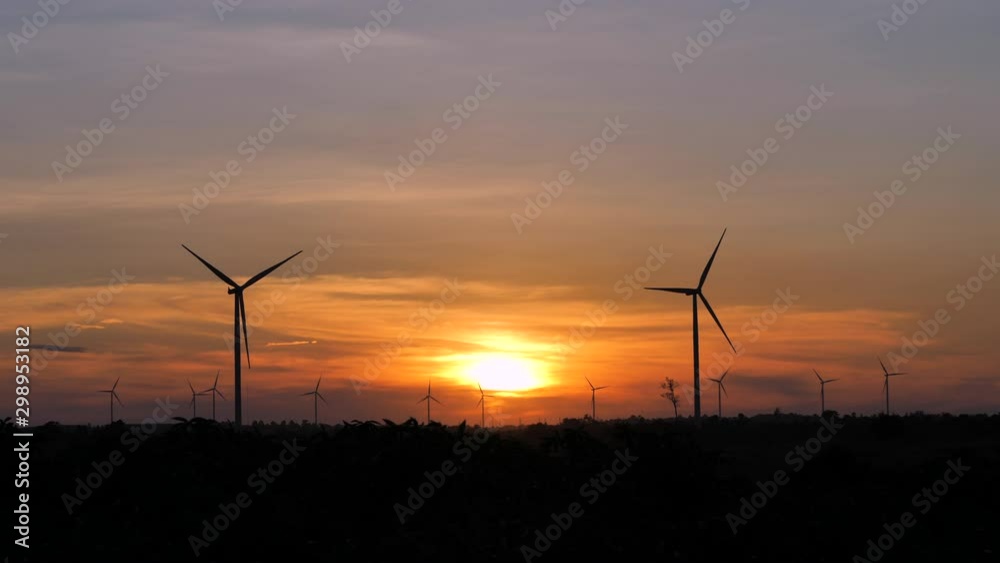 Scenic landscape of the wind turbine for electric power make against nature agriculture farm for renewable clean power from wind in twilight sunset time with dark and grain processed