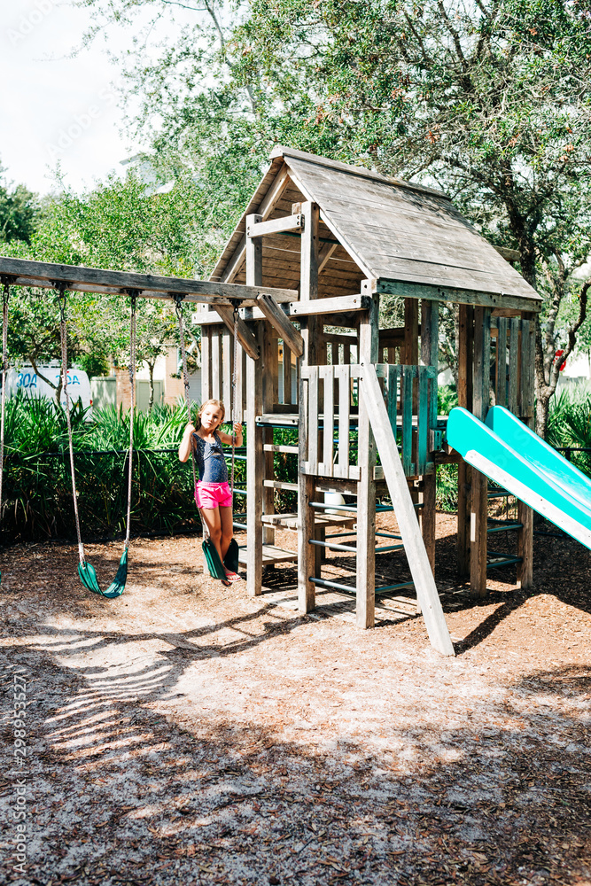 Little Girl on Wooden Playground Little Girl on Wooden Playground