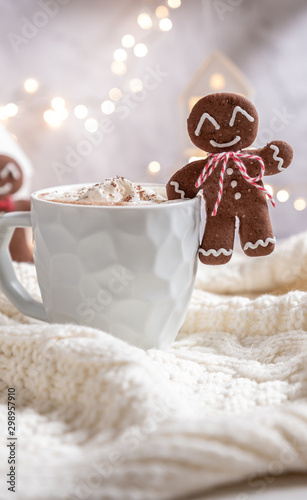 Gingerbread cookie man with a hot chocolate for Christmas holiday