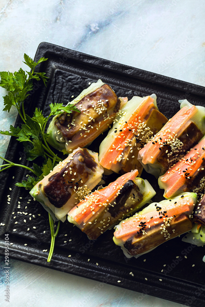 healthy vegan spring rice paper rolls with fried tofu cheese and fresh vegetables and almond sauce healthy vegan spring rice paper rolls with fried tofu cheese and fresh vegetables and almond sauce