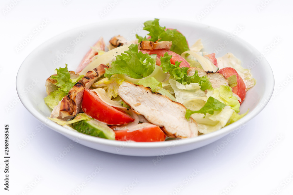 white deep plates with fresh salad ingredients mixed with sauce placed on isolated white background. A place for a menu, banner or advertisement white deep plates with fresh salad ingredients mixed with sauce placed on isolated white background. A place for a menu, banner or advertisement