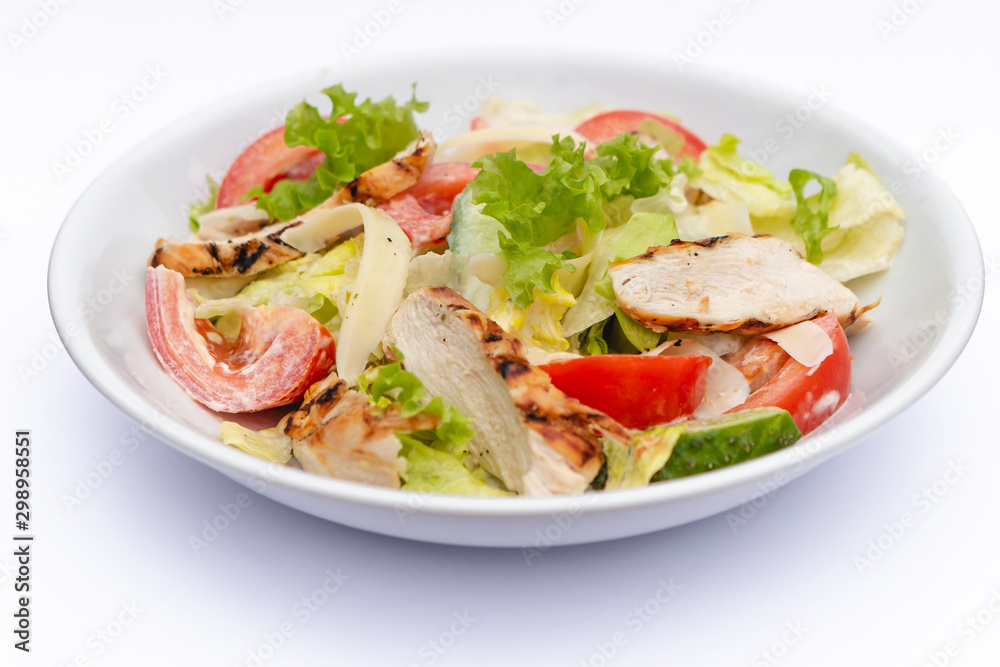 white deep plates with fresh salad ingredients mixed with sauce placed on isolated white background. A place for a menu, banner or advertisement white deep plates with fresh salad ingredients mixed with sauce placed on isolated white background. A place for a menu, banner or advertisement
