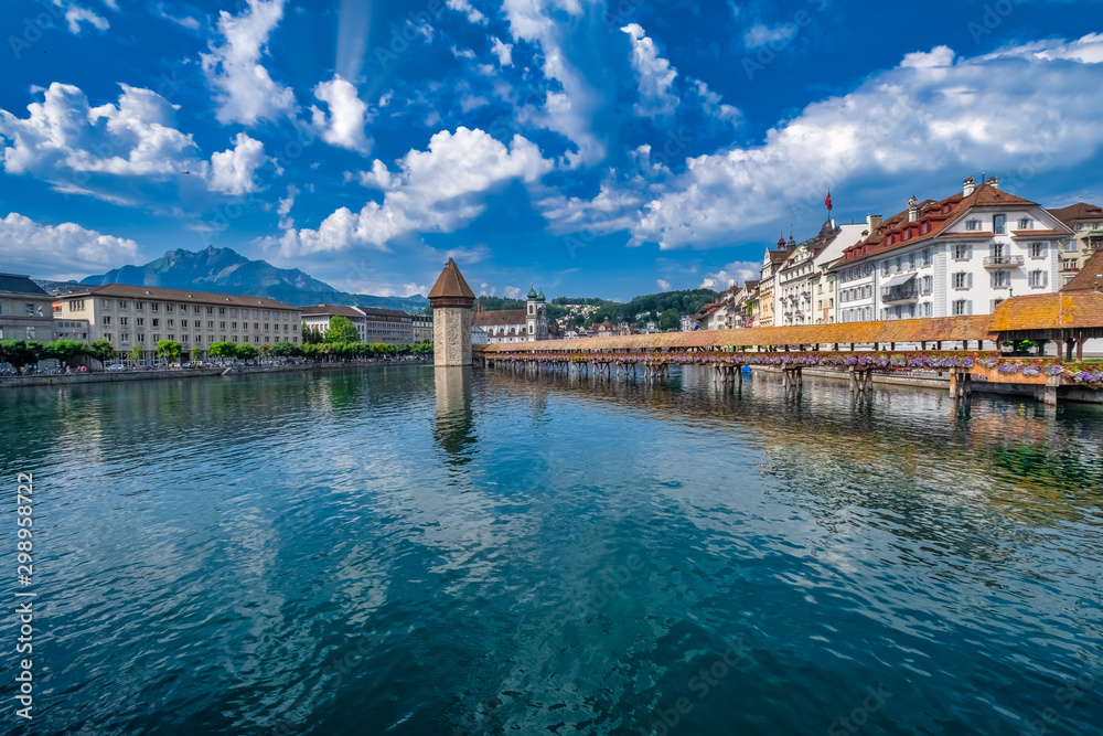 The Chapel Bridge (Kapellbrucke) a covered wooden truss footbridge spanning the River Reuss in the city of Lucerne in central Switzerland.