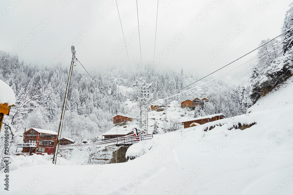 Wooden chalets under blizzard. Wooden chalets under blizzard.