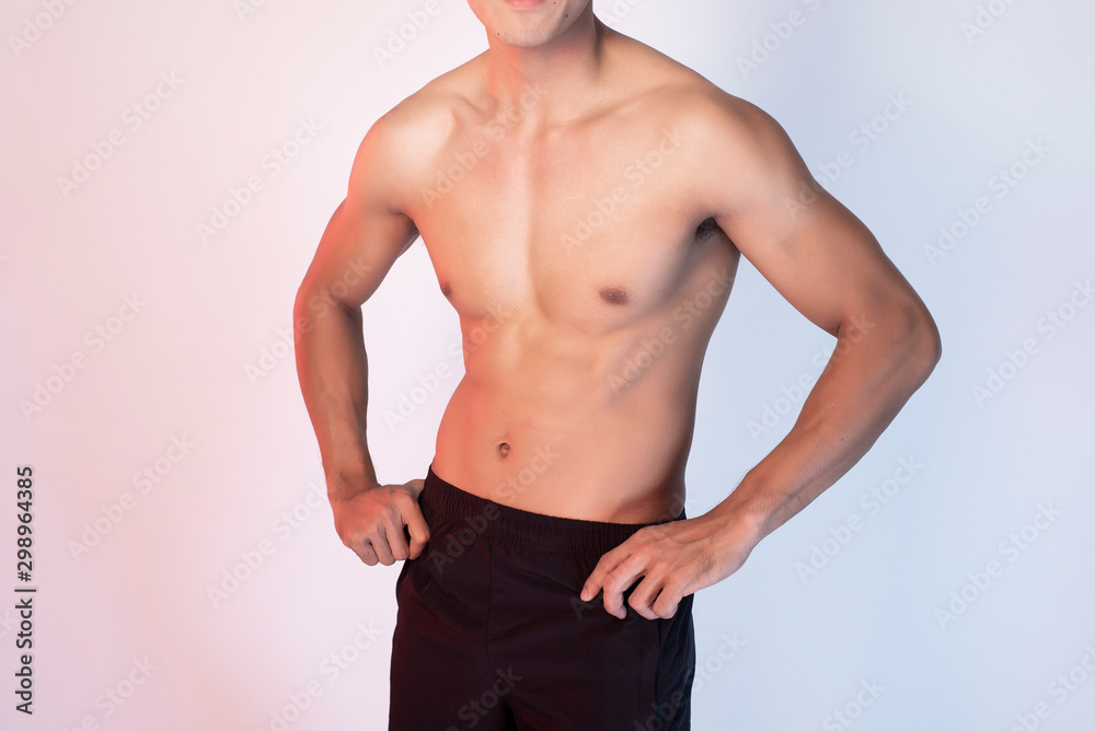 Handsome Muscular fitness man in studio