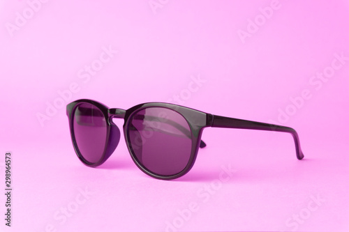 Pink vintage sunglasses on a pure pink background