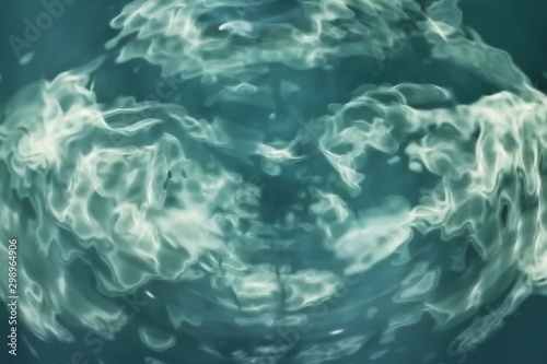 aquamarine ripples on water close-up texture background © VADZIM