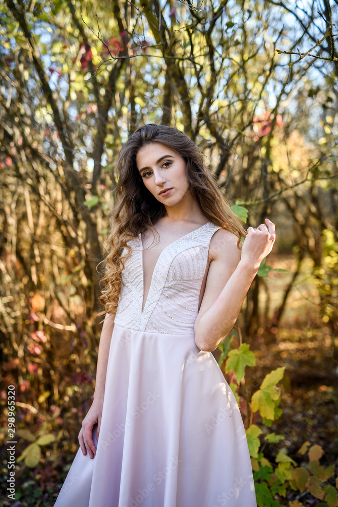 Two young princess wearing nice beige dress in autumn park. Fashion photo. Two young princess wearing nice beige dress in autumn park. Fashion photo.